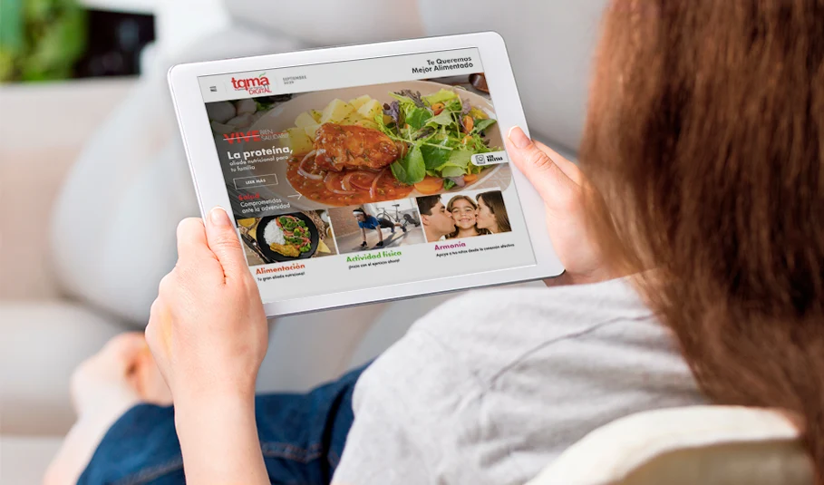 TQMA digital magazine on a tablet: a protein feature under the Vive Bien headline, with the three content pillars running along the bottom — Alimentación, Actividad física and Armonía.